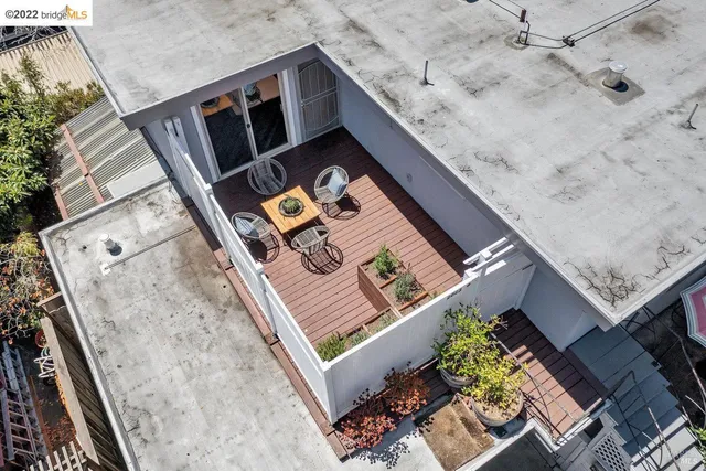 a view of a backyard with chairs