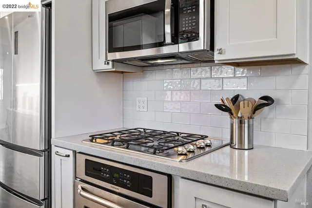 a kitchen with a stove and a microwave