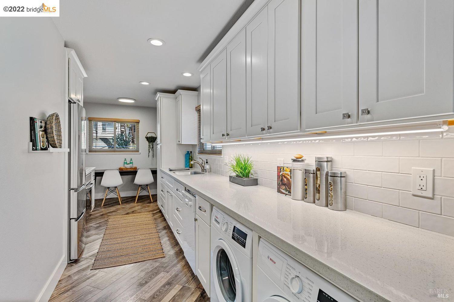 2021 Key Boulevard El Cerrito, CA 94530 - Photo 9 of 30 a kitchen with stainless steel appliances granite countertop a lot of counter space and wooden floors