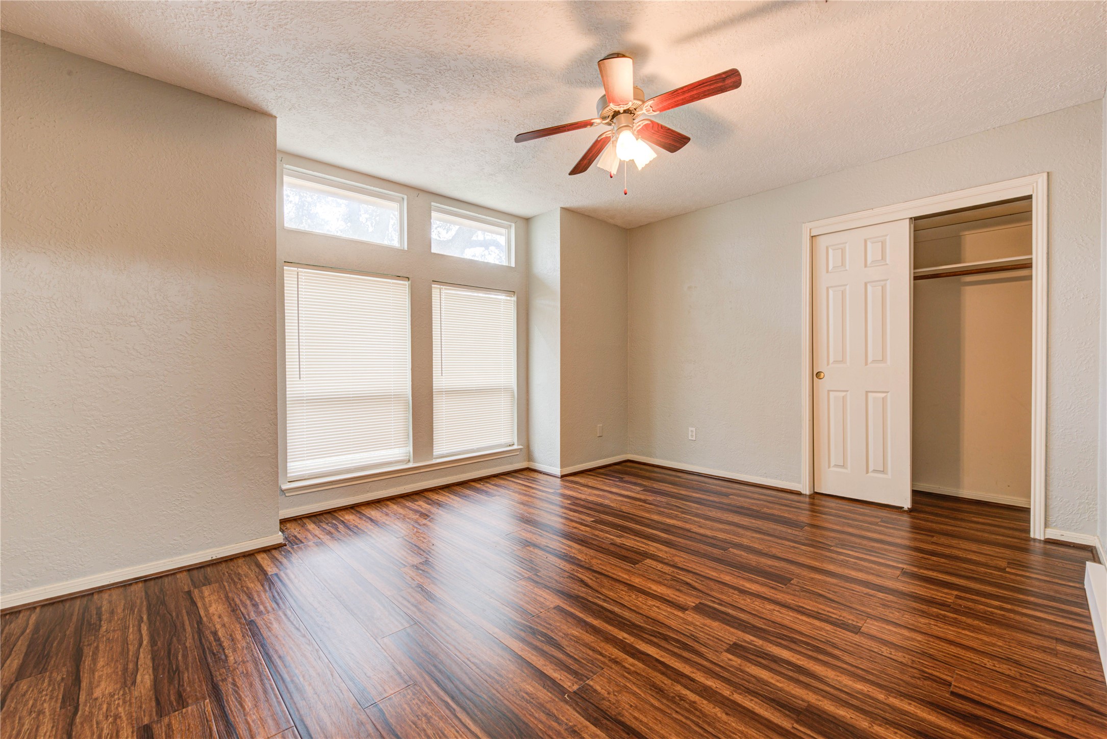 2122 Paso Rello Drive Houston, TX 77077 - Photo 11 of 20 wooden floor in an empty room with a window
