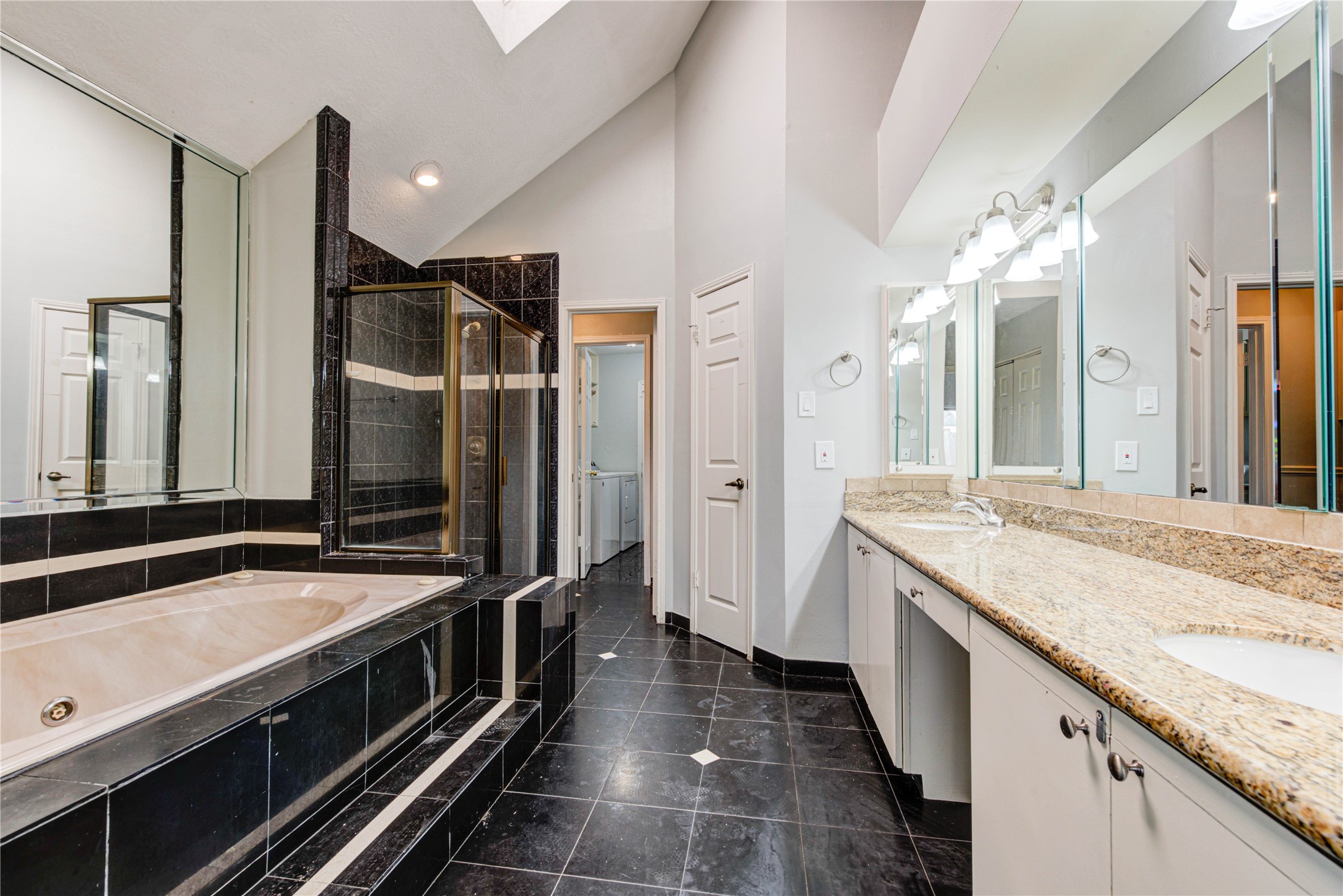 2122 Paso Rello Drive Houston, TX 77077 - Photo 15 of 20 a bathroom with a sink and a large mirror