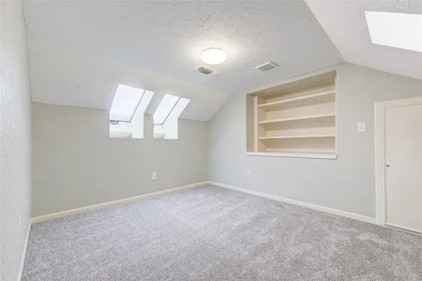 a view of empty room with windows