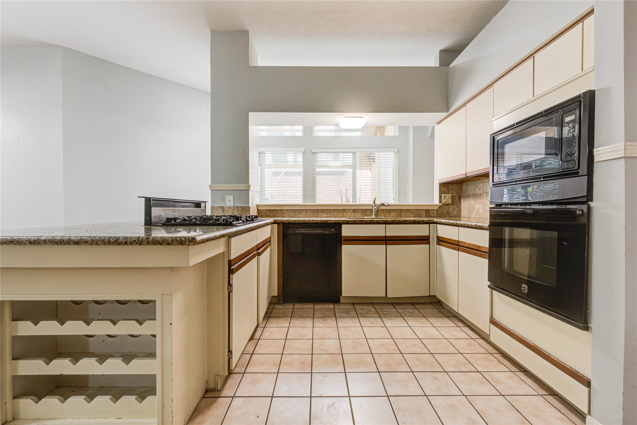 2122 Paso Rello Drive Houston, TX 77077 - Photo 20 of 20 a kitchen with stainless steel appliances granite countertop a stove a sink and a microwave