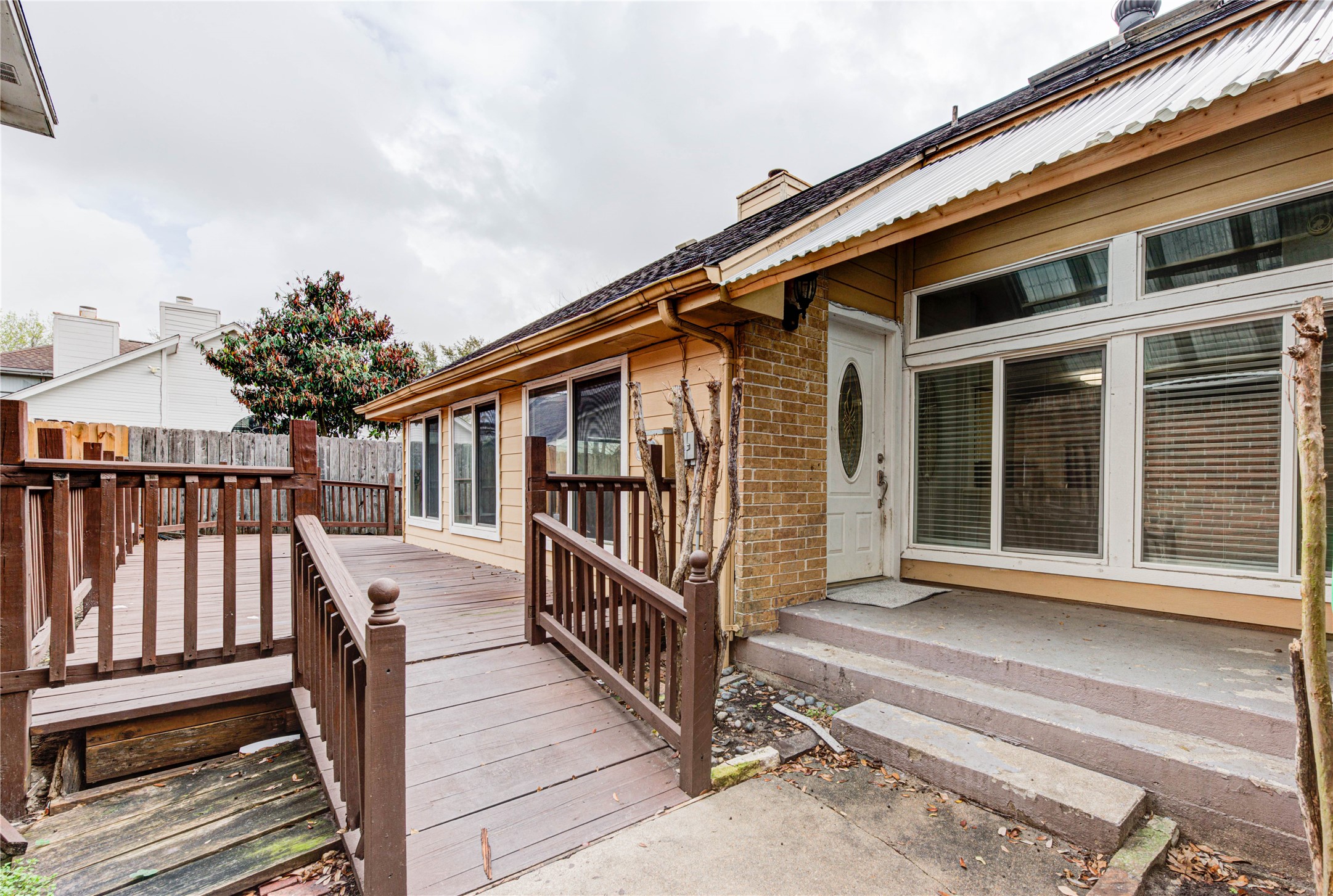 2122 Paso Rello Drive Houston, TX 77077 - Photo 3 of 20 a porch with wooden floor in front of it