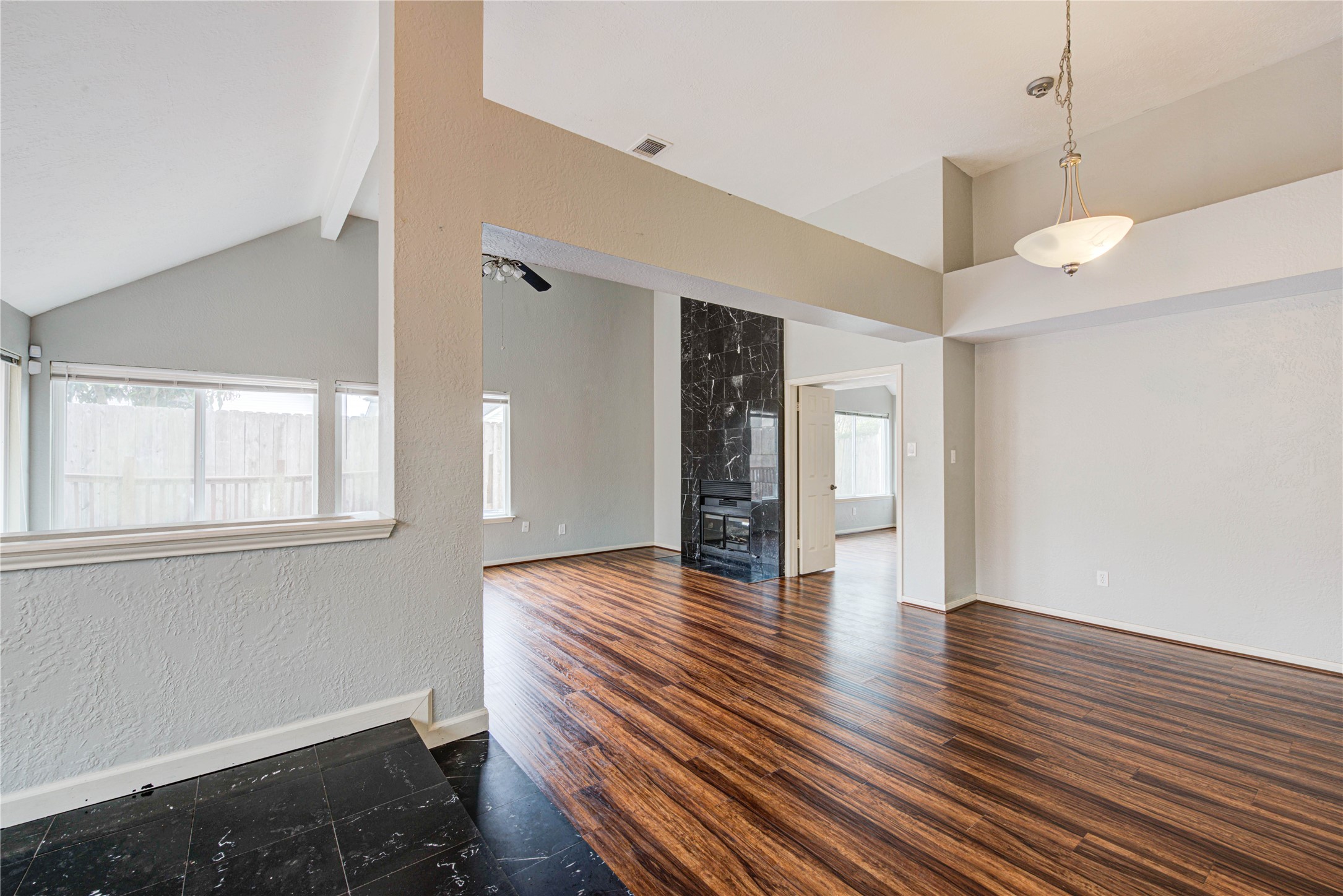 2122 Paso Rello Drive Houston, TX 77077 - Photo 5 of 20 a view of an empty room with wooden floor and a window