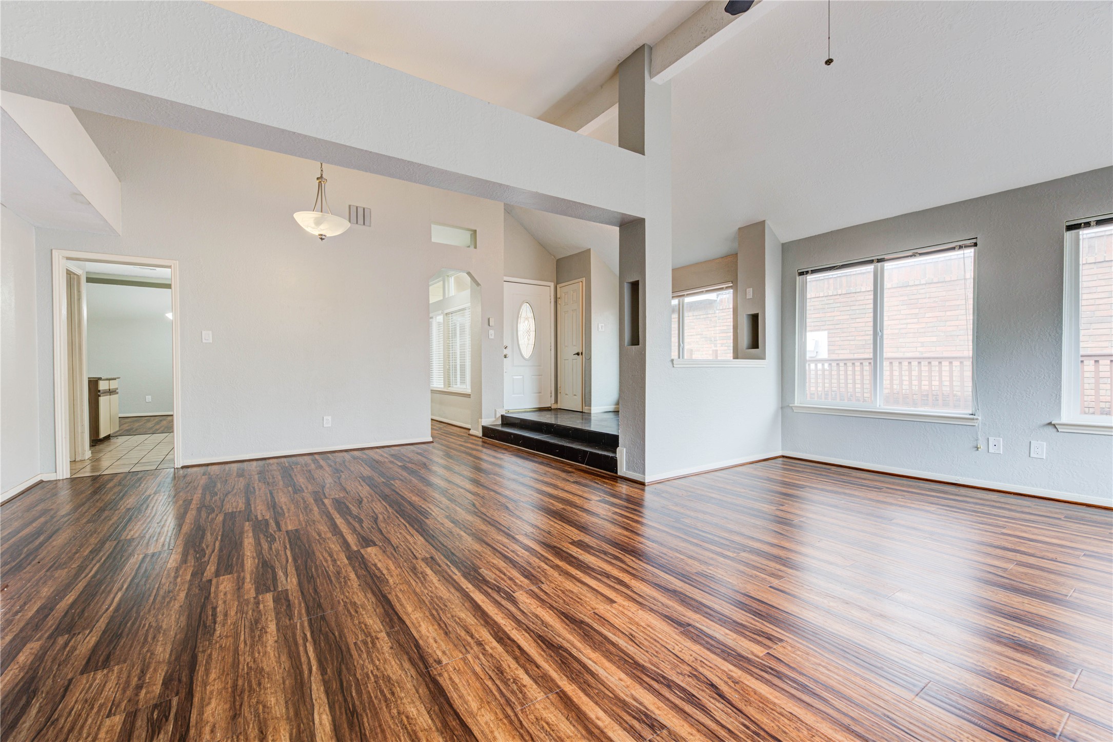 2122 Paso Rello Drive Houston, TX 77077 - Photo 7 of 20 wooden floor in an empty room with a window