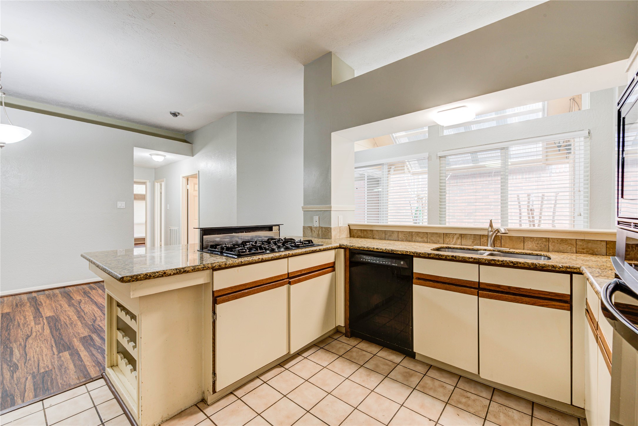 2122 Paso Rello Drive Houston, TX 77077 - Photo 8 of 20 a kitchen with stainless steel appliances granite countertop a stove and a sink