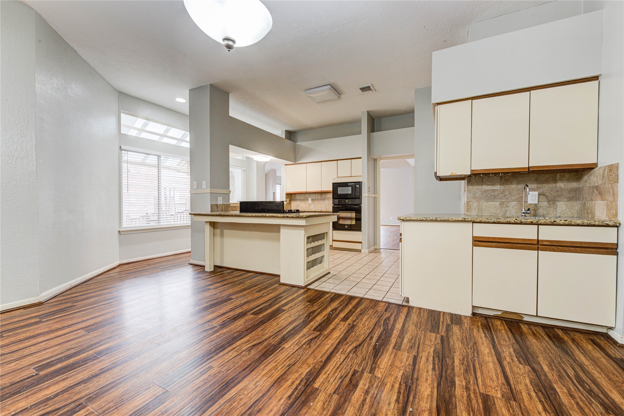 2122 Paso Rello Drive Houston, TX 77077 - Photo 10 of 20 a kitchen with wooden floors and appliances