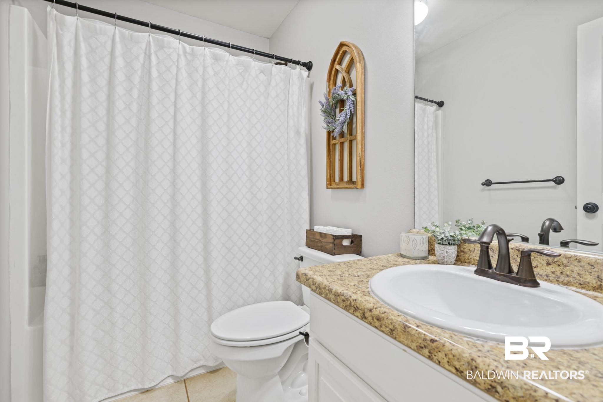 8956 Spring Grove North Mobile, AL 36695 - Photo 12 of 19 Bathroom featuring vanity, toilet, tile patterned flooring, and curtained shower