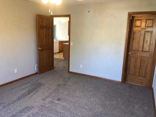 10149 Monarch Road, Unit 4 Roscoe, IL 61073 - Photo 13 of 21 an empty room with closet and wooden floor
