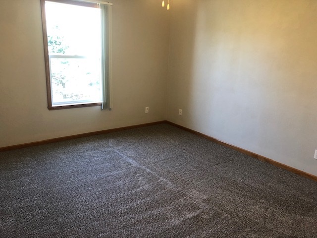 10149 Monarch Road, Unit 4 Roscoe, IL 61073 - Photo 17 of 21 an empty room with a window