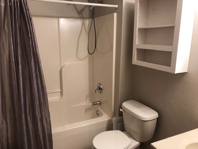 10149 Monarch Road, Unit 4 Roscoe, IL 61073 - Photo 19 of 21 a bathroom with a toilet and a shower