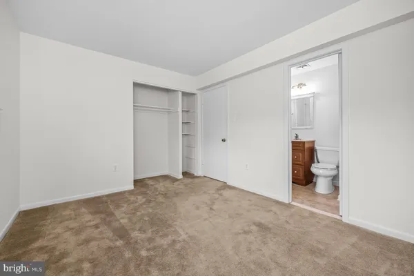 a view of an empty room with a bathroom