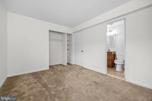 a view of an empty room with a bathroom