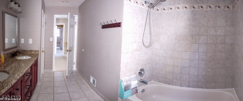 6 Whitehead Road Bridgewater, NJ 08807 - Photo 11 of 14 a bathroom with a granite countertop bathtub shower and mirror