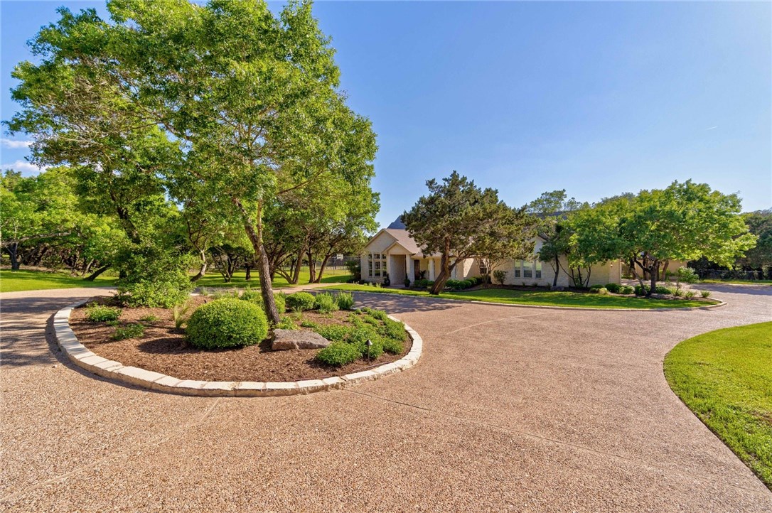 a view of a swimming pool with a yard