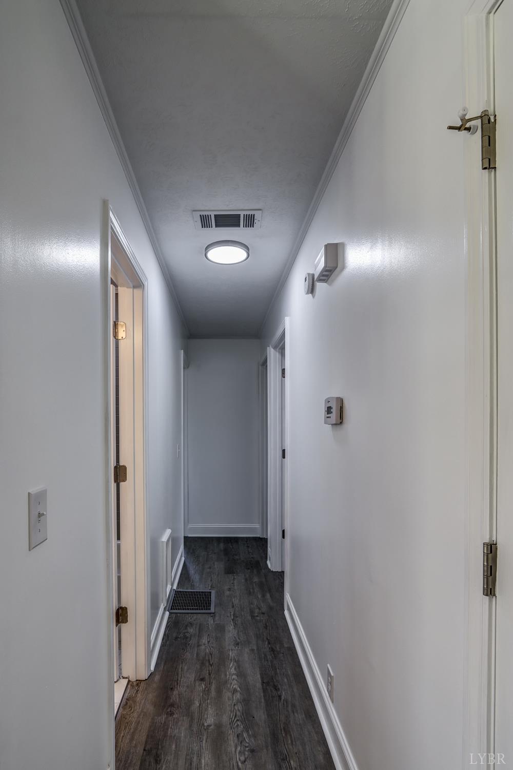 303 Grove Street Hurt, VA 24563 - Photo 21 of 51 a view of a hallway with wooden floor
