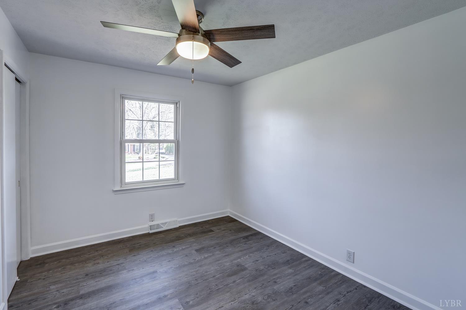 303 Grove Street Hurt, VA 24563 - Photo 24 of 51 an empty room with a window and a fan