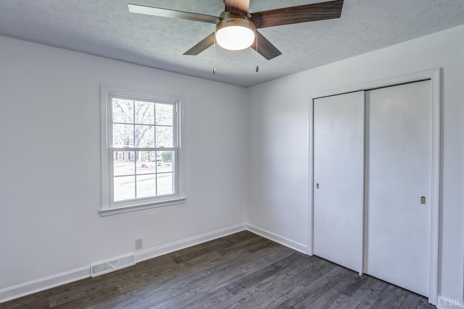 303 Grove Street Hurt, VA 24563 - Photo 26 of 51 wooden floor in an empty room with a window