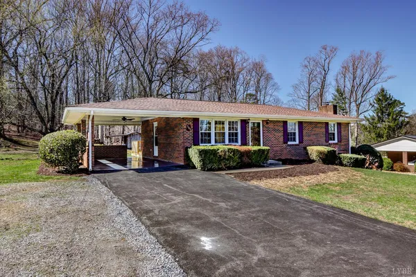 a view of house with outdoor space and swimming pool