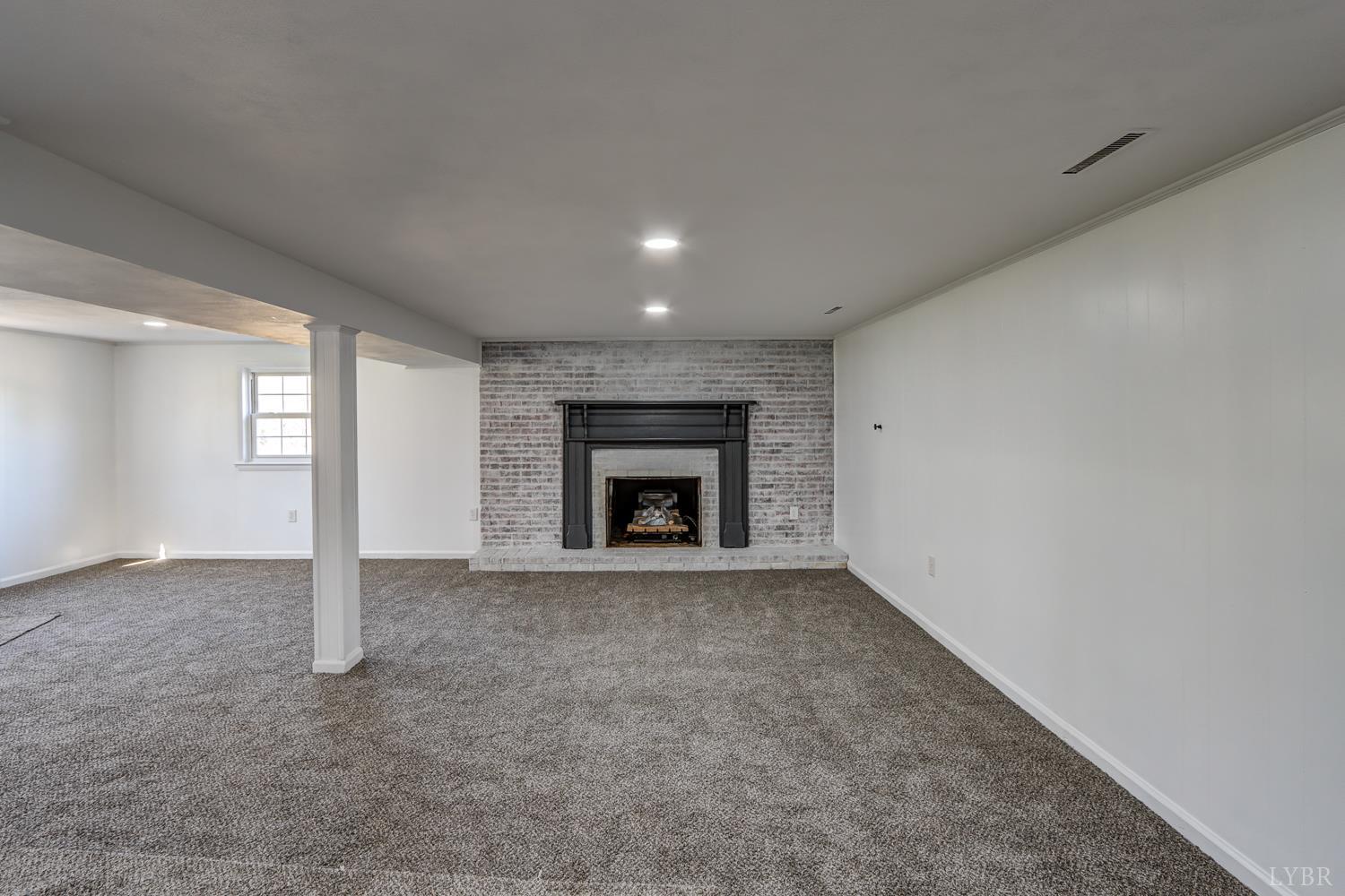 303 Grove Street Hurt, VA 24563 - Photo 33 of 51 a view of an empty room with a fireplace