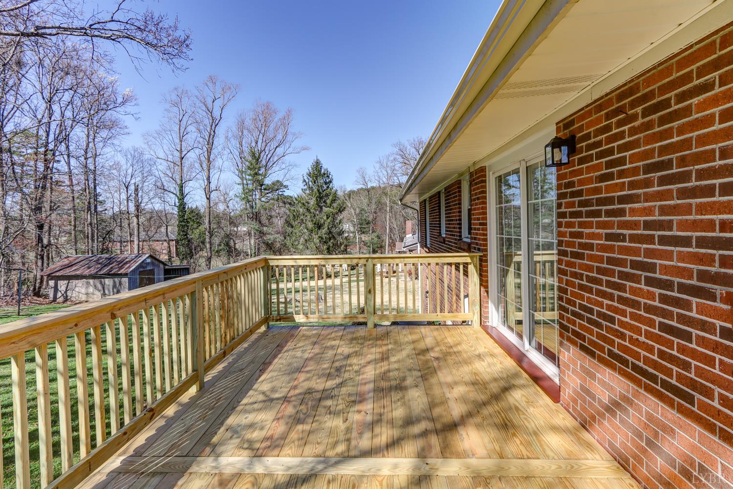 303 Grove Street Hurt, VA 24563 - Photo 48 of 51 a view of a balcony with wooden floor and fence