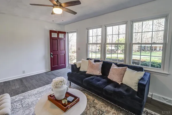 a kitchen with stainless steel appliances granite countertop a stove and white cabinets