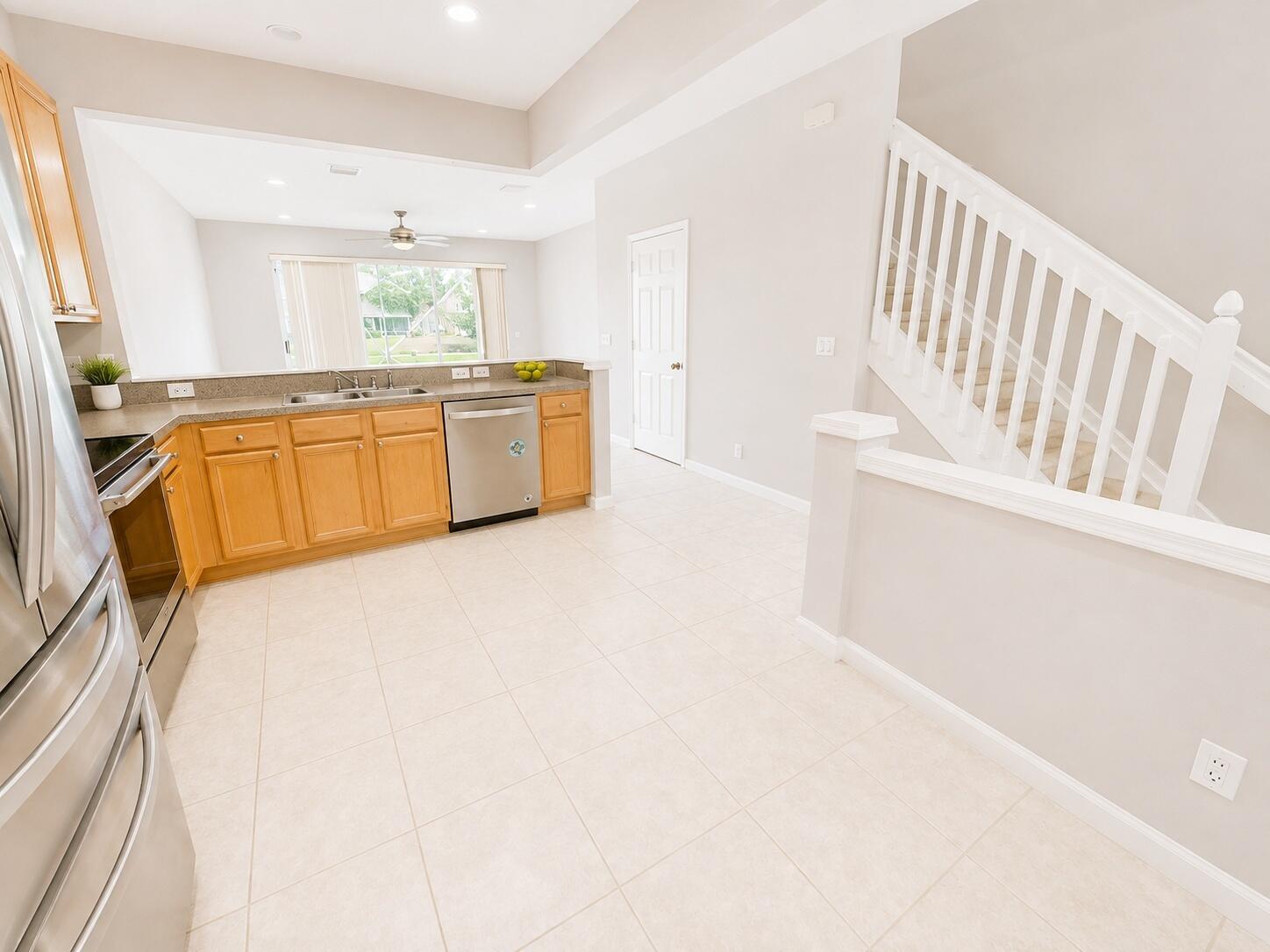 1083 Woodfield Road, Unit 1083 Greenacres, FL 33415 - Photo 9 of 23 bright_kitchen_staircase