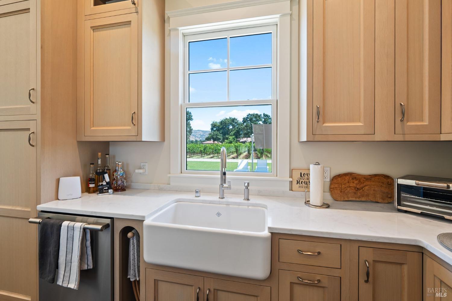 3140 Big Ranch Road Napa, CA 94558 - Photo 15 of 59 Farmhouse sink with views out to the pool and vineyards