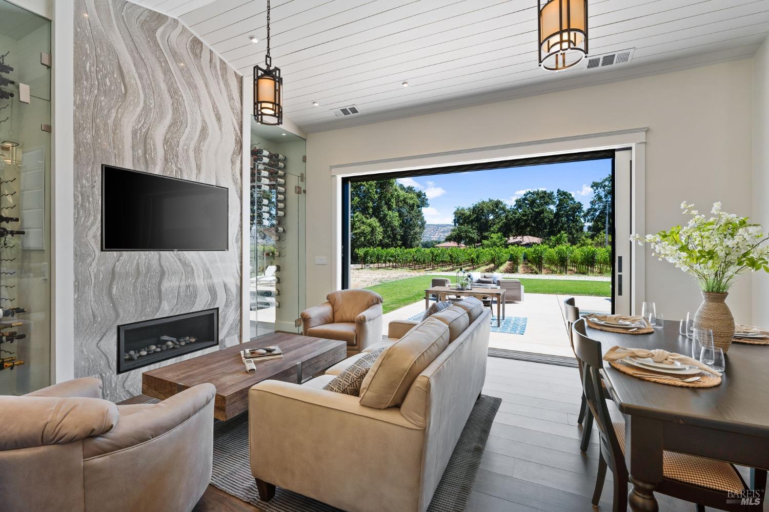 3140 Big Ranch Road Napa, CA 94558 - Photo 17 of 59 Relaxing TV area includes a custom quartz fireplace surround and dual temperature controlled wine storage.