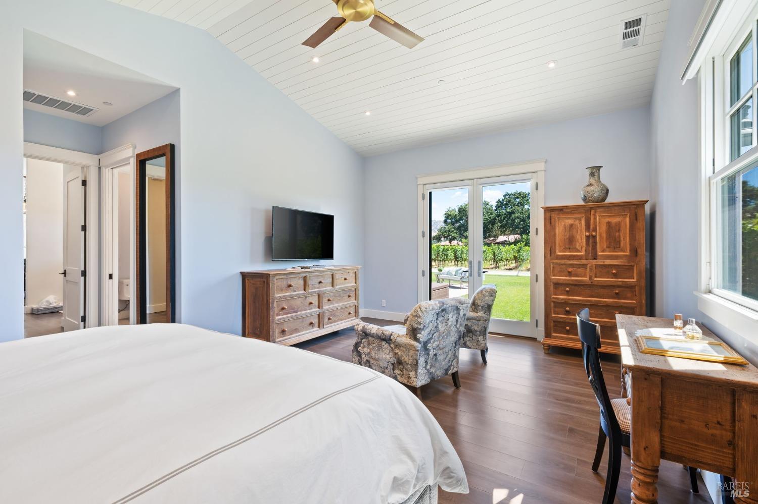 3140 Big Ranch Road Napa, CA 94558 - Photo 19 of 59 Primary bedroom includes its own sitting area and French doors to the backyard.