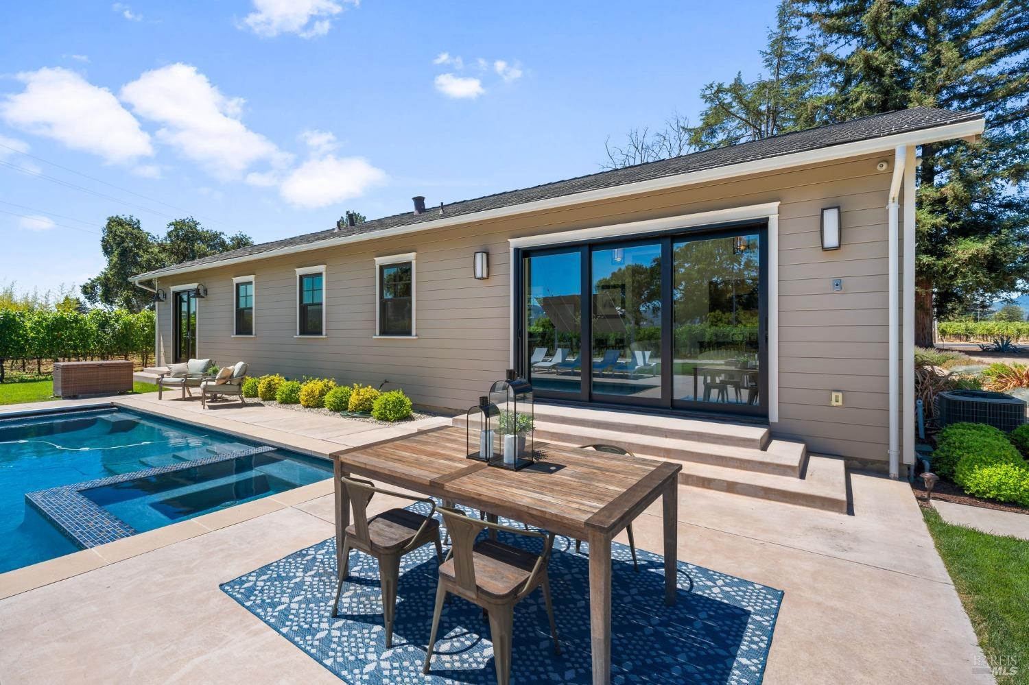 3140 Big Ranch Road Napa, CA 94558 - Photo 35 of 59 Backyard features a large patio, pool/spa, firepit, and grass area for activities.