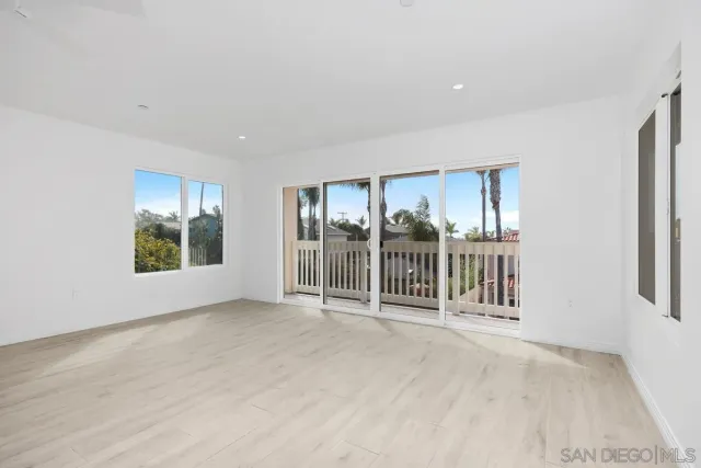 a view of a room with balcony and furniture