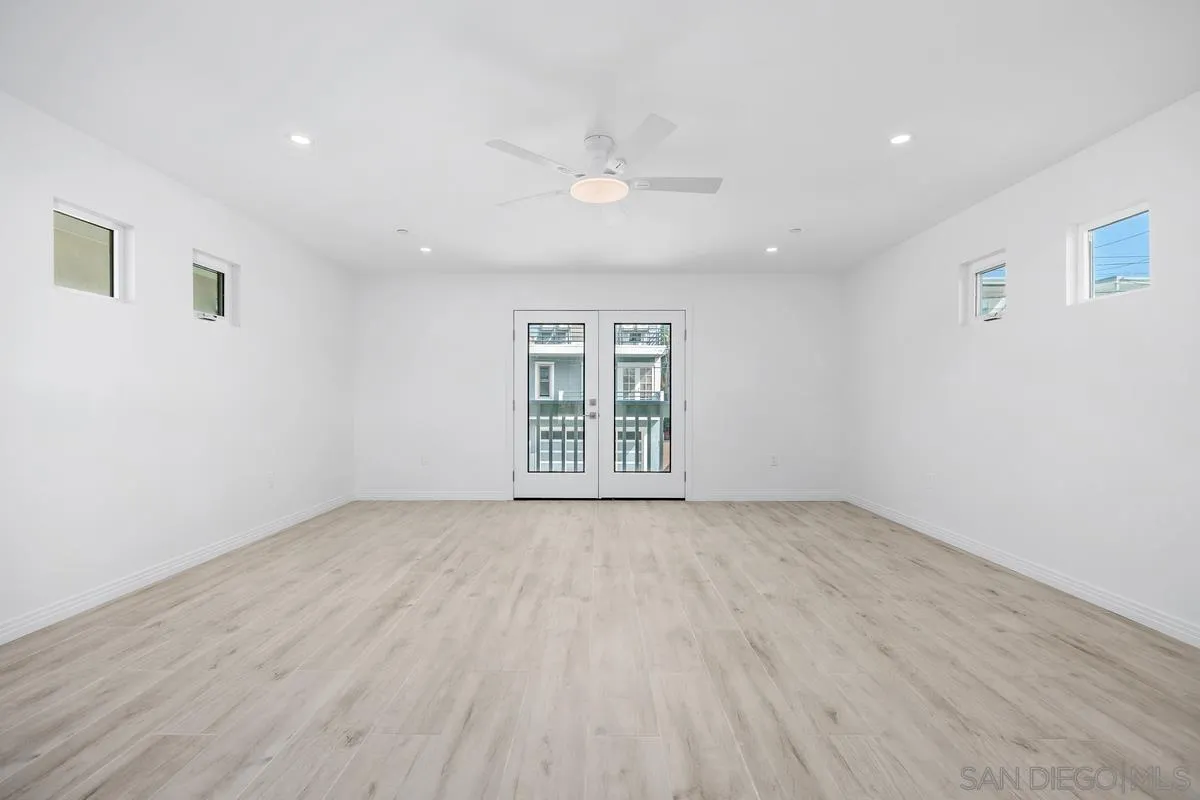2157 Manchester Avenue Cardiff, CA 92007 - Photo 24 of 35 a view of an empty room with a window and wooden floor