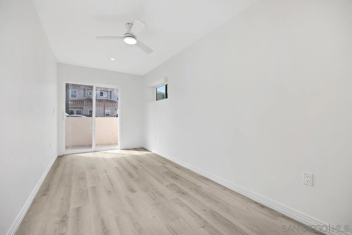 2157 Manchester Avenue Cardiff, CA 92007 - Photo 26 of 35 a view of wooden floor and windows in a room