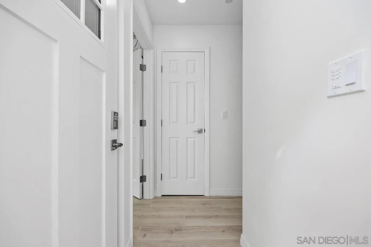 2157 Manchester Avenue Cardiff, CA 92007 - Photo 35 of 35 a view of a hallway with wooden floor