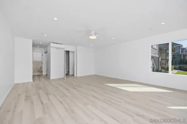 a view of empty room with windows