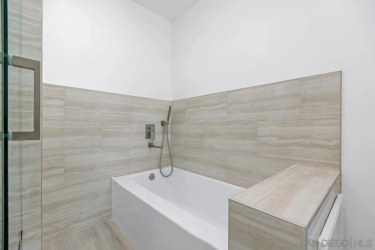 2157 Manchester Avenue Cardiff, CA 92007 - Photo 10 of 35 a bathroom with a bathtub and shower