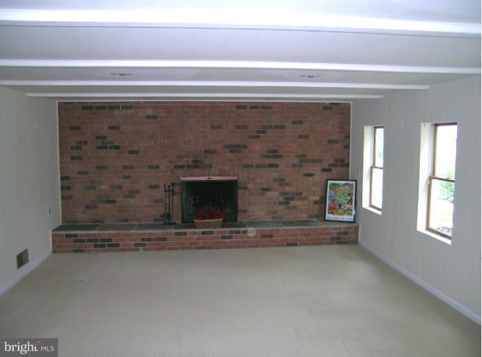 1708 Woodwell Road Silver Spring, MD 20906 - Photo 13 of 18 Family Room with raised hearth brick fireplace