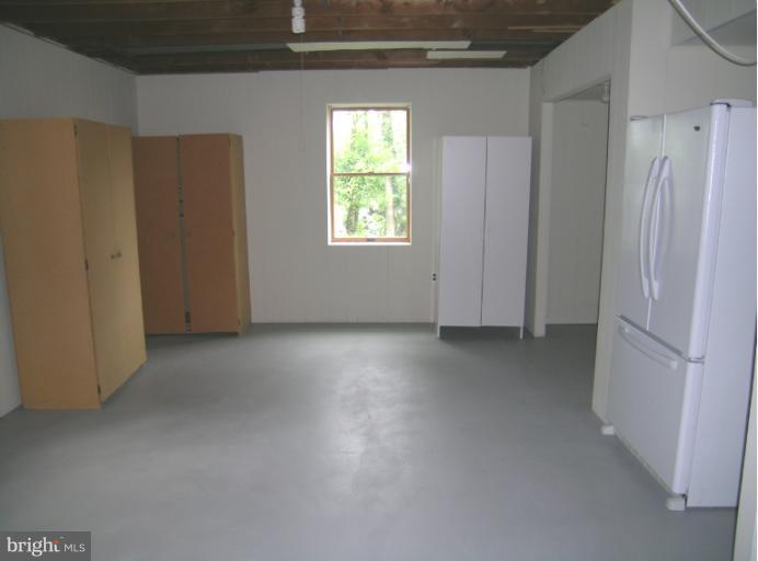1708 Woodwell Road Silver Spring, MD 20906 - Photo 3 of 18 Huge laundry room with storage and extra refrig.