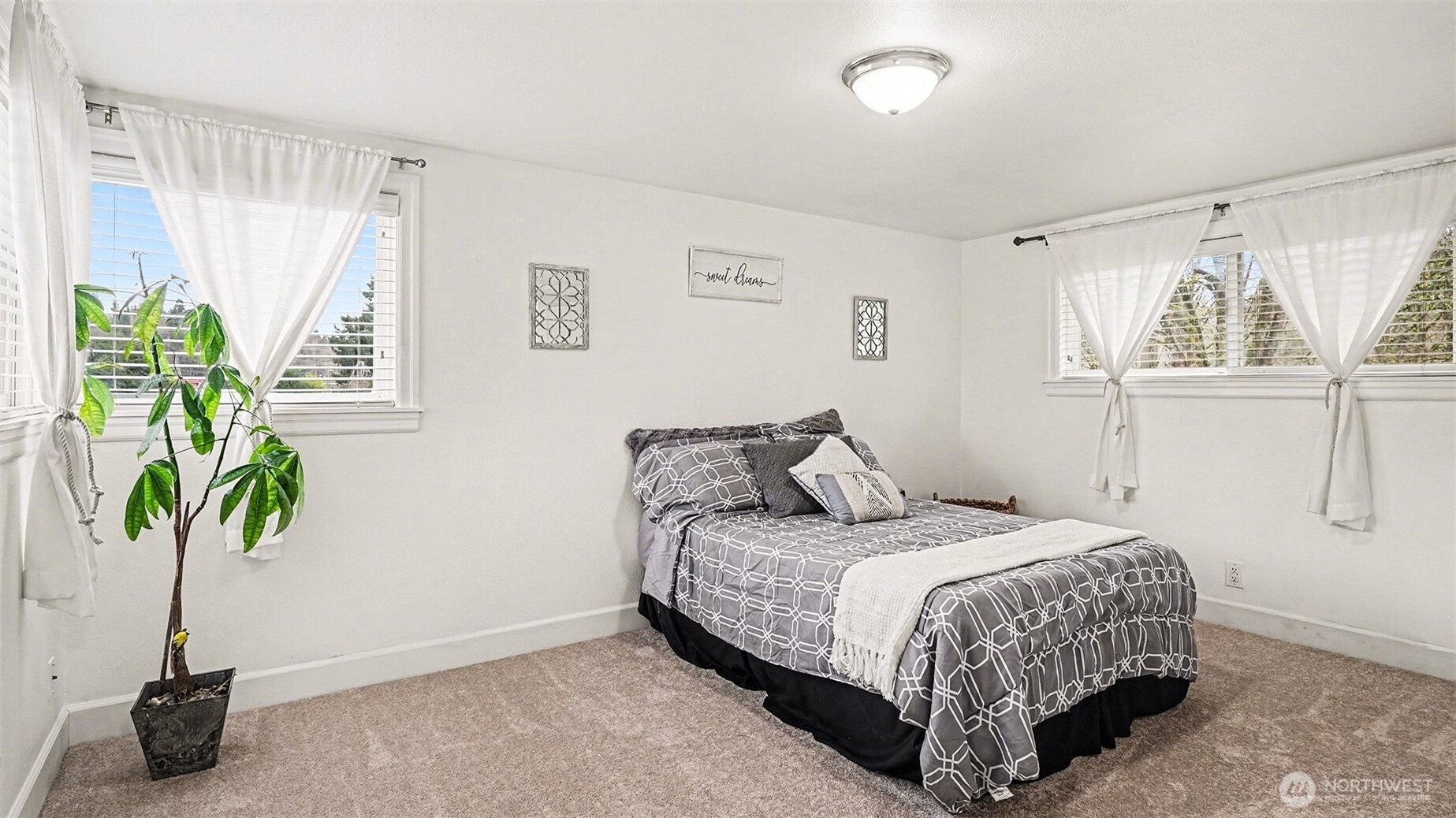 544 Simons Road Monroe, WA 98272 - Photo 15 of 34 a bedroom with a bed and a potted plant