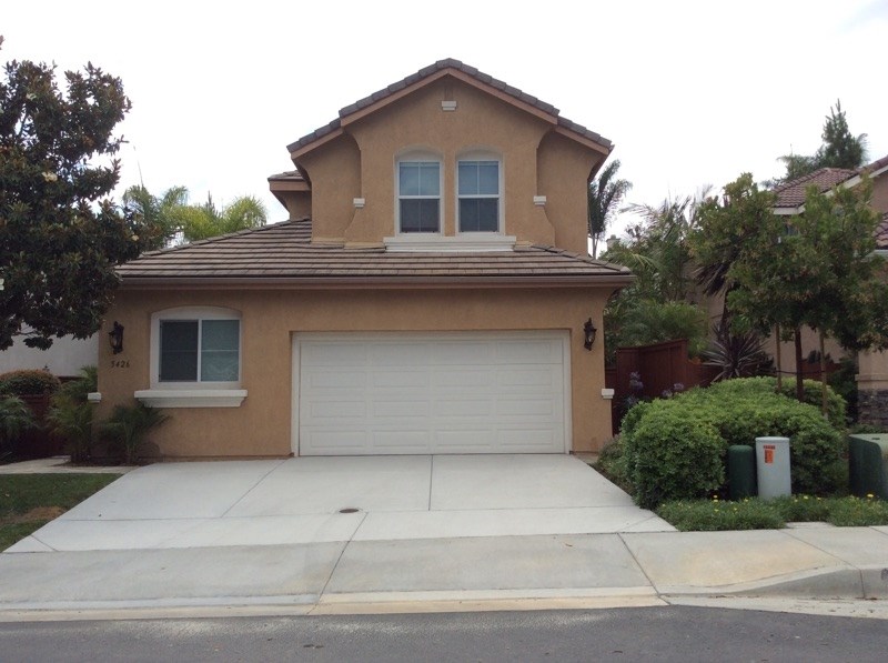 a front view of a house with garage and garage
