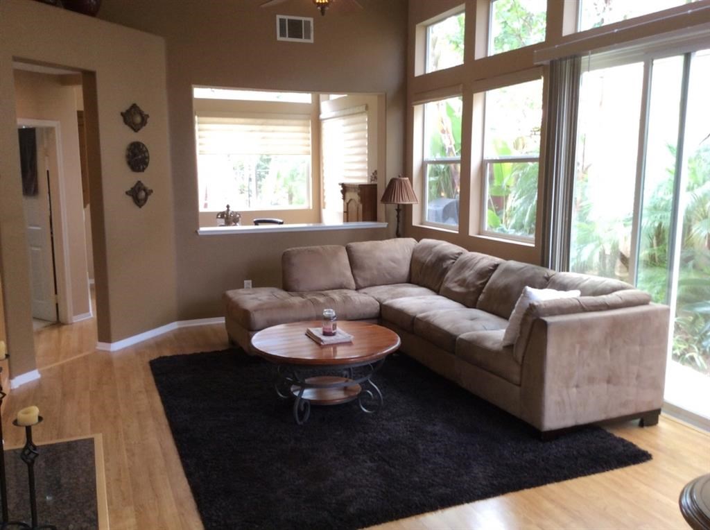 5426 Foxtail Loop Carlsbad, CA 92010 - Photo 3 of 15 a living room with furniture and a large window