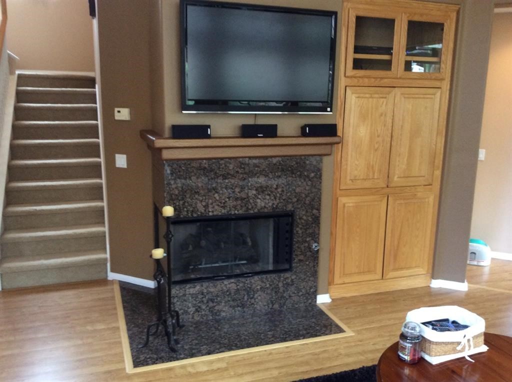 5426 Foxtail Loop Carlsbad, CA 92010 - Photo 4 of 15 a living room with a fireplace and a flat screen tv