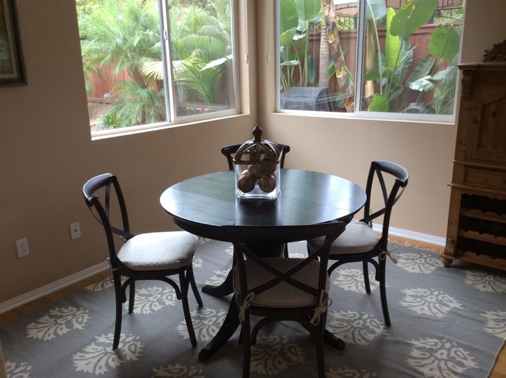 5426 Foxtail Loop Carlsbad, CA 92010 - Photo 5 of 15 a view of a dining room with furniture window and outside view