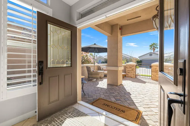 a kitchen with kitchen island granite countertop a stove sink and microwave
