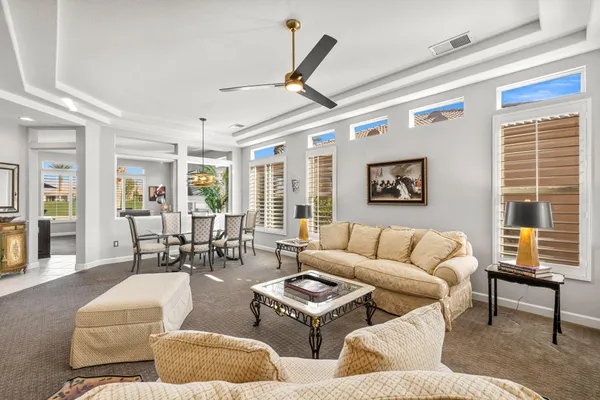 a kitchen with stainless steel appliances granite countertop wooden cabinets a stove top oven a sink and dishwasher