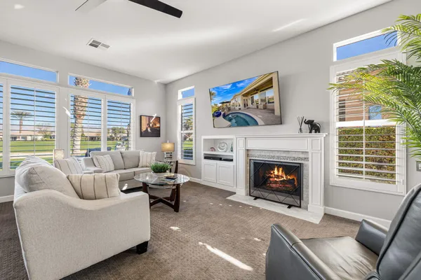 a bathroom with a double vanity sink large mirror and a bathtub