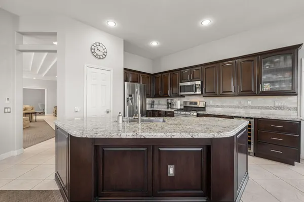 a bedroom with a bed and a lamp