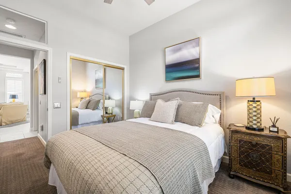 a aerial view of a house with table and chairs under an umbrella